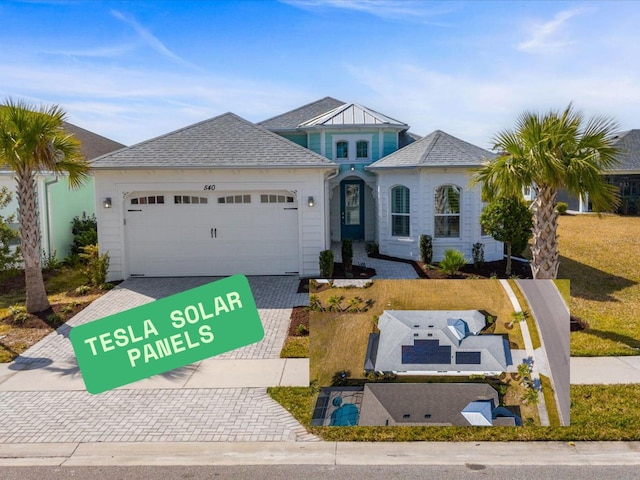 540 Good Life Way, Daytona Beach, FL 32124 - view of front of house featuring an attached garage and decorative driveway