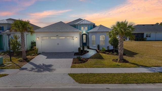 540 Good Life Way, Daytona Beach, FL 32124 - view of front of property with a garage, decorative driveway, and a front lawn