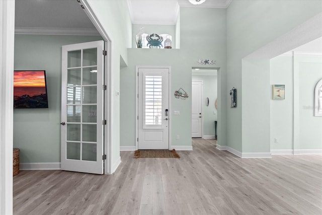 540 Good Life Way, Daytona Beach, FL 32124 - entrance foyer featuring ornamental molding, wood finished floors, baseboards, and a towering ceiling