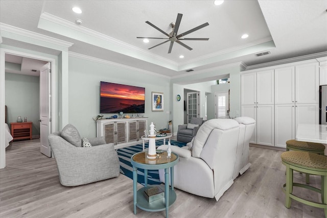 540 Good Life Way, Daytona Beach, FL 32124 - living area featuring a raised ceiling, ceiling fan, light wood finished floors, ornamental molding, and recessed lighting
