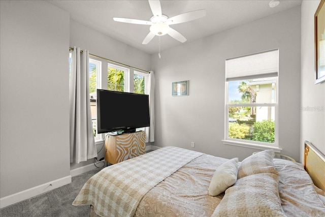 bedroom featuring carpet floors, baseboards, and ceiling fan