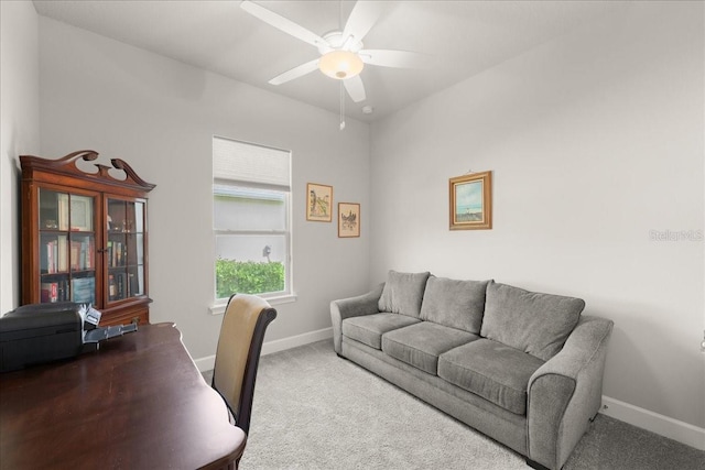 office space with carpet flooring, baseboards, and ceiling fan