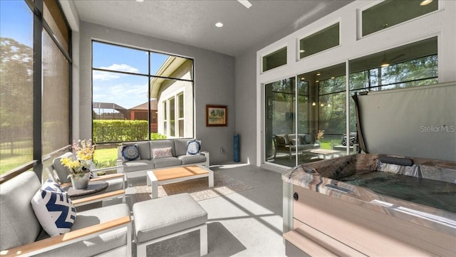 sunroom featuring an outdoor living space