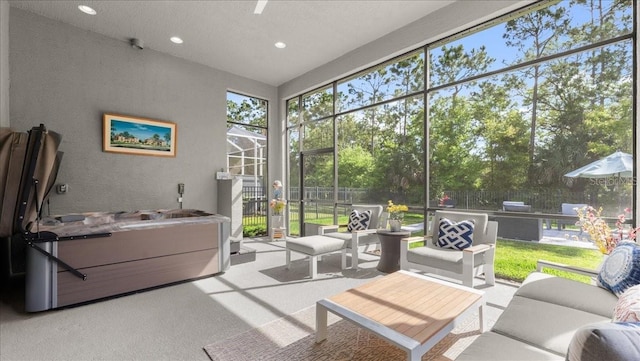 sunroom featuring an outdoor living space and a healthy amount of sunlight