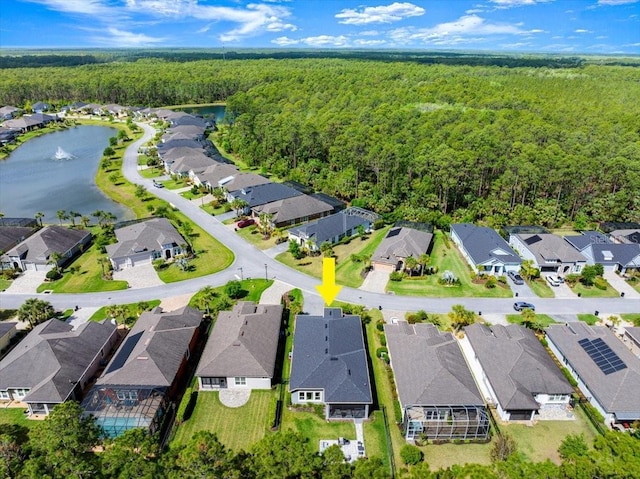 bird's eye view with a forest view, a residential view, and a water view
