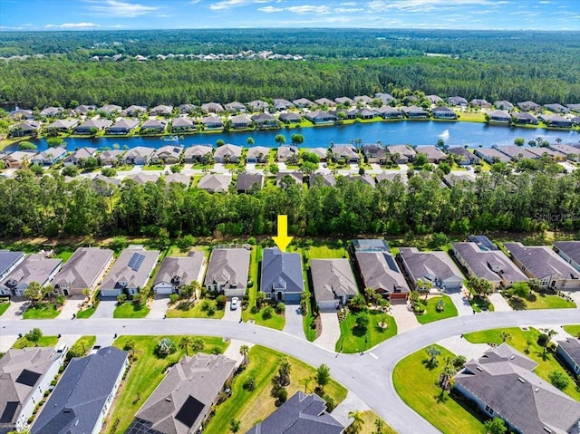 drone / aerial view featuring a water view and a residential view