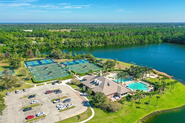 drone / aerial view with a view of trees and a water view