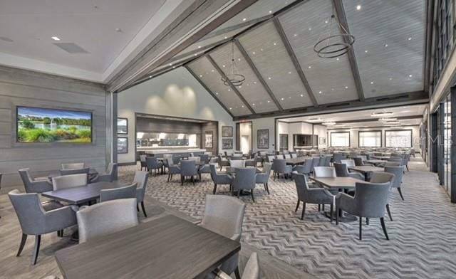 dining space with a towering ceiling