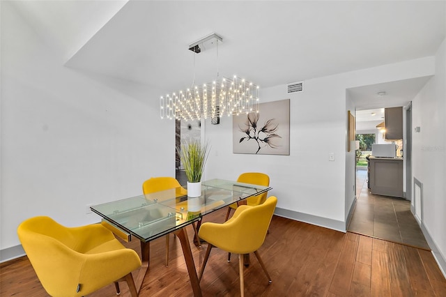 dining space featuring visible vents, baseboards, and hardwood / wood-style floors
