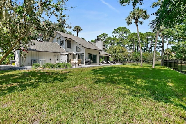 view of yard featuring a patio area and fence