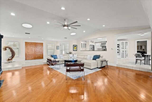 2924 River Point Dr, Daytona Beach, FL 32118 - living area with light wood-style floors, visible vents, ceiling fan, and vaulted ceiling