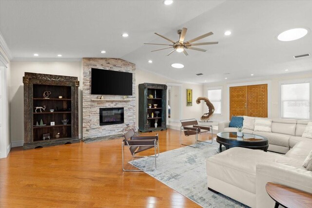 2924 River Point Dr, Daytona Beach, FL 32118 - living area featuring vaulted ceiling, crown molding, visible vents, ceiling fan, and wood finished floors