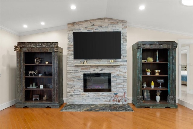 2924 River Point Dr, Daytona Beach, FL 32118 - living area with baseboards, ornamental molding, a stone fireplace, wood finished floors, and lofted ceiling