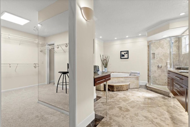 2924 River Point Dr, Daytona Beach, FL 32118 - full bath with vanity, a spacious closet, a textured ceiling, a shower stall, and a bath