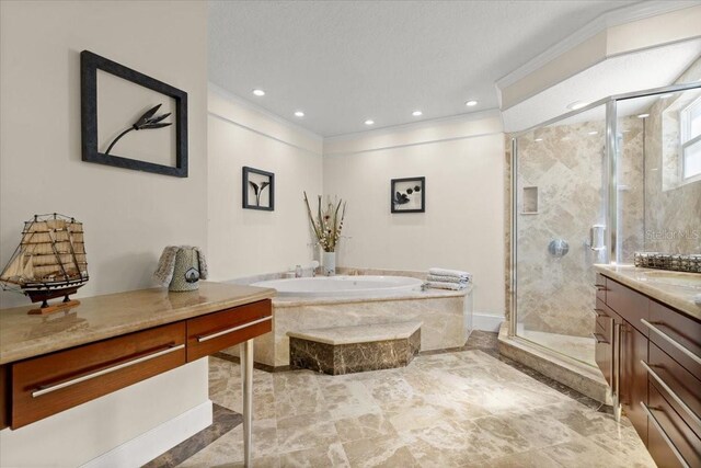 2924 River Point Dr, Daytona Beach, FL 32118 - bathroom with ornamental molding, a shower stall, recessed lighting, vanity, and a garden tub