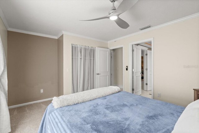 2924 River Point Dr, Daytona Beach, FL 32118 - bedroom featuring baseboards, ornamental molding, carpet flooring, a ceiling fan, and visible vents