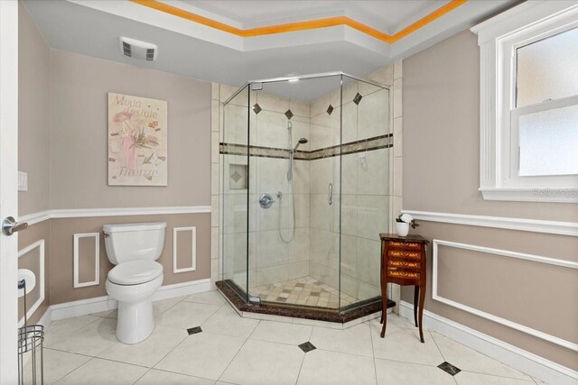 2924 River Point Dr, Daytona Beach, FL 32118 - bathroom featuring a shower stall, tile patterned floors, visible vents, and toilet