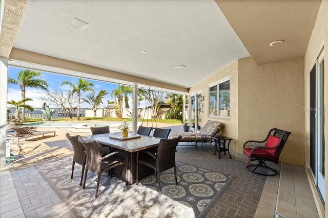 2924 River Point Dr, Daytona Beach, FL 32118 - view of patio / terrace featuring outdoor dining area and an outdoor pool