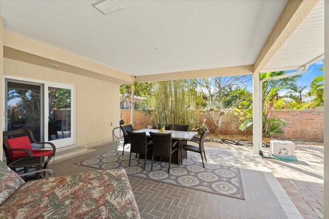 2924 River Point Dr, Daytona Beach, FL 32118 - view of patio / terrace featuring fence and outdoor dining area