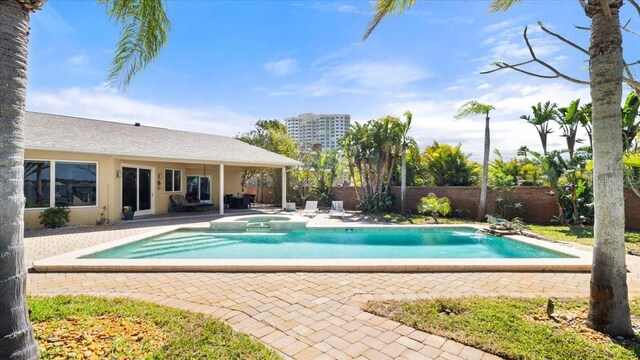 2924 River Point Dr, Daytona Beach, FL 32118 - view of pool featuring a patio area, a pool with connected hot tub, and fence