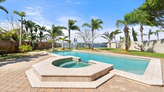 2924 River Point Dr, Daytona Beach, FL 32118 - view of pool with a patio, a fenced backyard, a fenced in pool, and an in ground hot tub