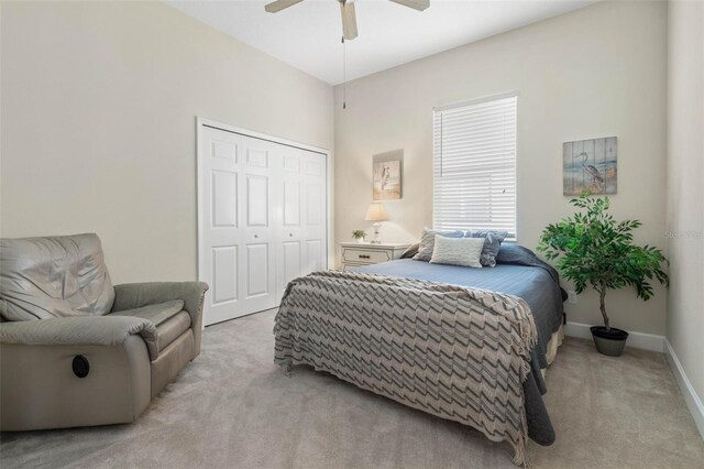 65 Heron Dr, Palm Coast, FL 32137 - bedroom with a closet, baseboards, a ceiling fan, and light colored carpet
