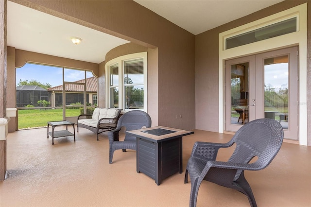 65 Heron Dr, Palm Coast, FL 32137 - view of patio featuring an outdoor living space with a fire pit and glass enclosure