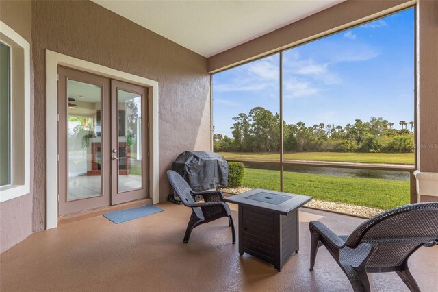 65 Heron Dr, Palm Coast, FL 32137 - sunroom / solarium with a water view and french doors