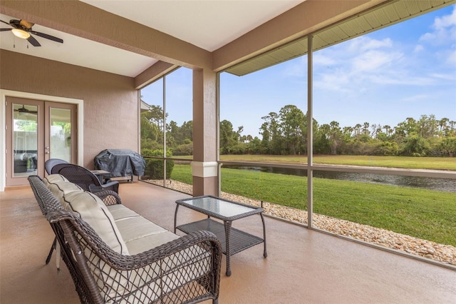 65 Heron Dr, Palm Coast, FL 32137 - sunroom / solarium featuring a water view, french doors, a ceiling fan, and an outdoor hangout area