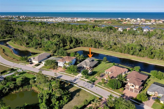 65 Heron Dr, Palm Coast, FL 32137 - drone / aerial view featuring a water view and a residential view