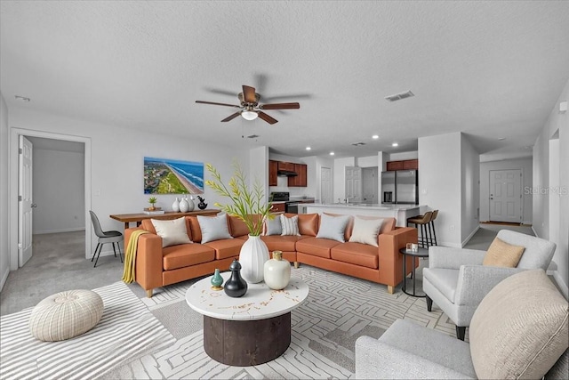 10 Post Oak Ln, Palm Coast, FL 32164 - living area featuring baseboards, ceiling fan, light carpet, a textured ceiling, and recessed lighting