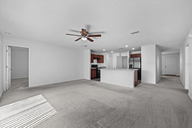 10 Post Oak Ln, Palm Coast, FL 32164 - unfurnished living room with baseboards, light carpet, ceiling fan, a textured ceiling, and recessed lighting