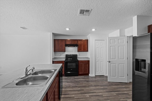 10 Post Oak Ln, Palm Coast, FL 32164 - kitchen featuring black appliances, a sink, dark wood-style flooring, light countertops, and a textured ceiling