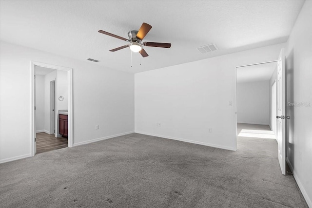 10 Post Oak Ln, Palm Coast, FL 32164 - empty room featuring carpet floors, a ceiling fan, and baseboards