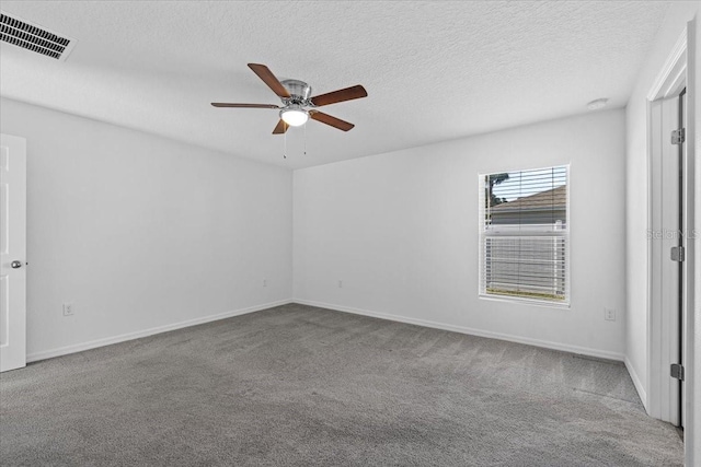 10 Post Oak Ln, Palm Coast, FL 32164 - spare room featuring carpet flooring, ceiling fan, baseboards, and a textured ceiling