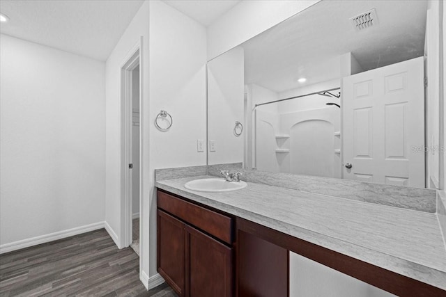10 Post Oak Ln, Palm Coast, FL 32164 - full bath featuring wood finished floors, baseboards, vanity, a shower, and recessed lighting