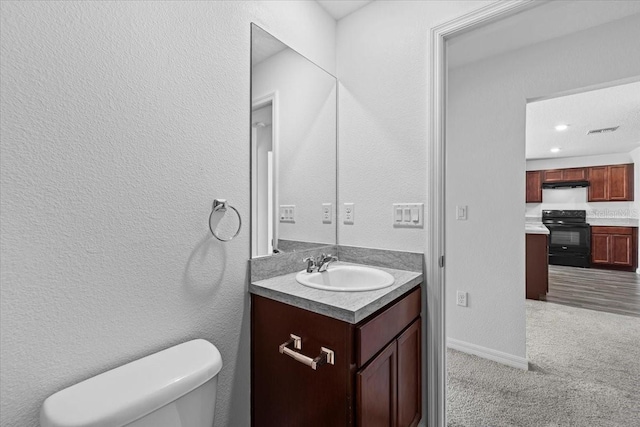 10 Post Oak Ln, Palm Coast, FL 32164 - bathroom featuring vanity, toilet, and baseboards