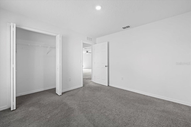 10 Post Oak Ln, Palm Coast, FL 32164 - unfurnished bedroom with carpet flooring, baseboards, a closet, and recessed lighting