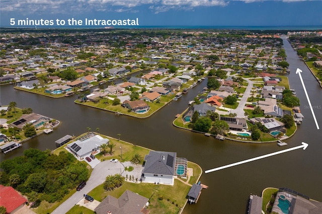 16 Florence Ct, Palm Coast, FL 32137 - aerial perspective of suburban area with a large body of water