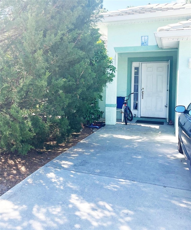 3 Frank Pl, Palm Coast, FL 32137 - property entrance with stucco siding