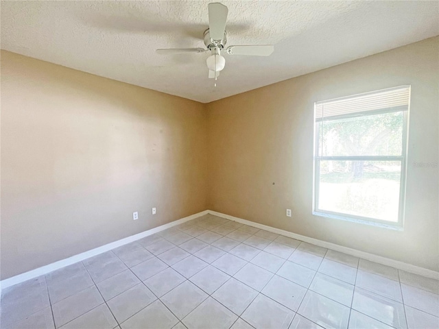 3 Frank Pl, Palm Coast, FL 32137 - empty room with a textured ceiling, ceiling fan, baseboards, and light tile patterned floors