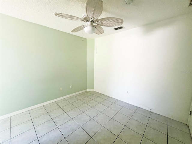 3 Frank Pl, Palm Coast, FL 32137 - spare room with light tile patterned floors, visible vents, a textured ceiling, and a ceiling fan