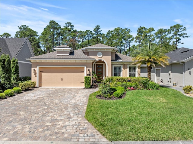 816 Creekwood Dr, Ormond Beach, FL 32174 - view of front of home featuring a shingled roof, a front lawn, stucco siding, decorative driveway, and a garage