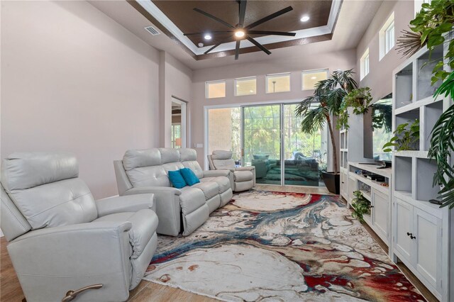 816 Creekwood Dr, Ormond Beach, FL 32174 - living area with visible vents, recessed lighting, light wood-style floors, a ceiling fan, and a raised ceiling