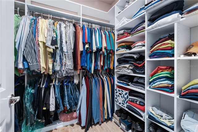 816 Creekwood Dr, Ormond Beach, FL 32174 - walk in closet with wood finished floors