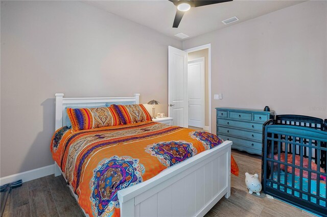 816 Creekwood Dr, Ormond Beach, FL 32174 - bedroom featuring wood finished floors, visible vents, a ceiling fan, and baseboards