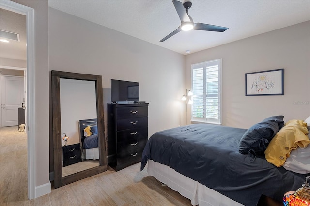 816 Creekwood Dr, Ormond Beach, FL 32174 - bedroom with visible vents, light wood finished floors, baseboards, and ceiling fan
