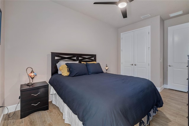 816 Creekwood Dr, Ormond Beach, FL 32174 - bedroom with visible vents, baseboards, wood finished floors, and a closet