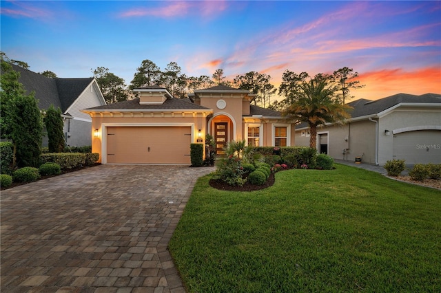 816 Creekwood Dr, Ormond Beach, FL 32174 - view of front facade featuring an attached garage, a front yard, stucco siding, and decorative driveway