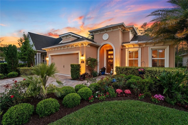 816 Creekwood Dr, Ormond Beach, FL 32174 - mediterranean / spanish-style home with a garage, driveway, and stucco siding